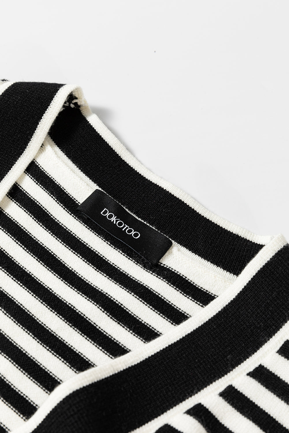 Schwarz gestreifte langarm-tunika-strickjacke