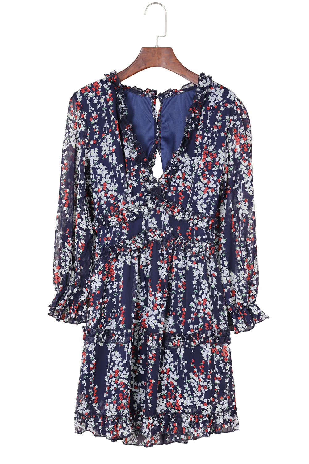 Blaues kleid mit rüschenbesatz und offenem rücken mit blumenmuster