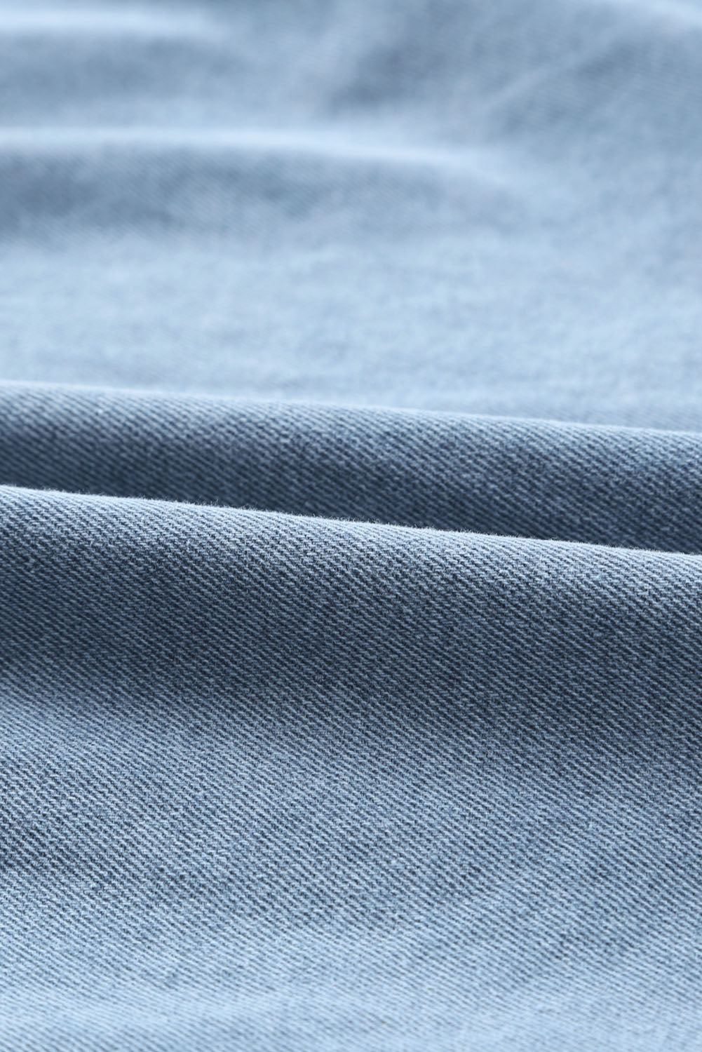Hemelse blauwe denim mini-jurk met lange mouwen met knopen