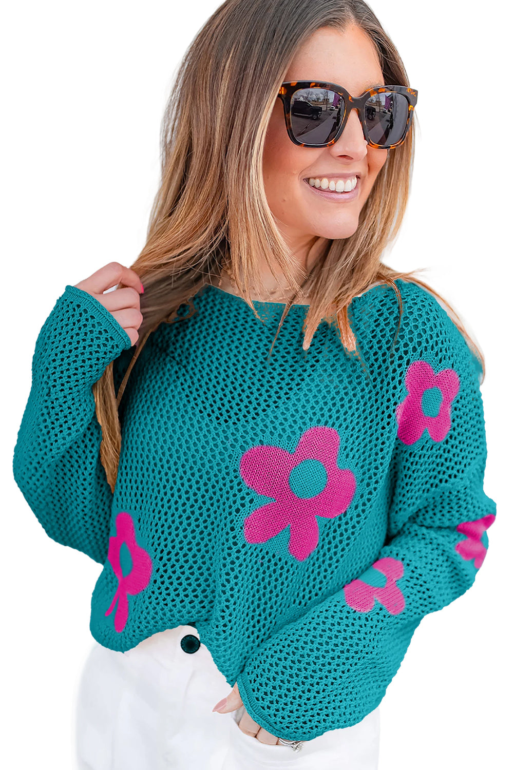Meergrüner pullover mit großer blume und hohlen schultern aus strick
