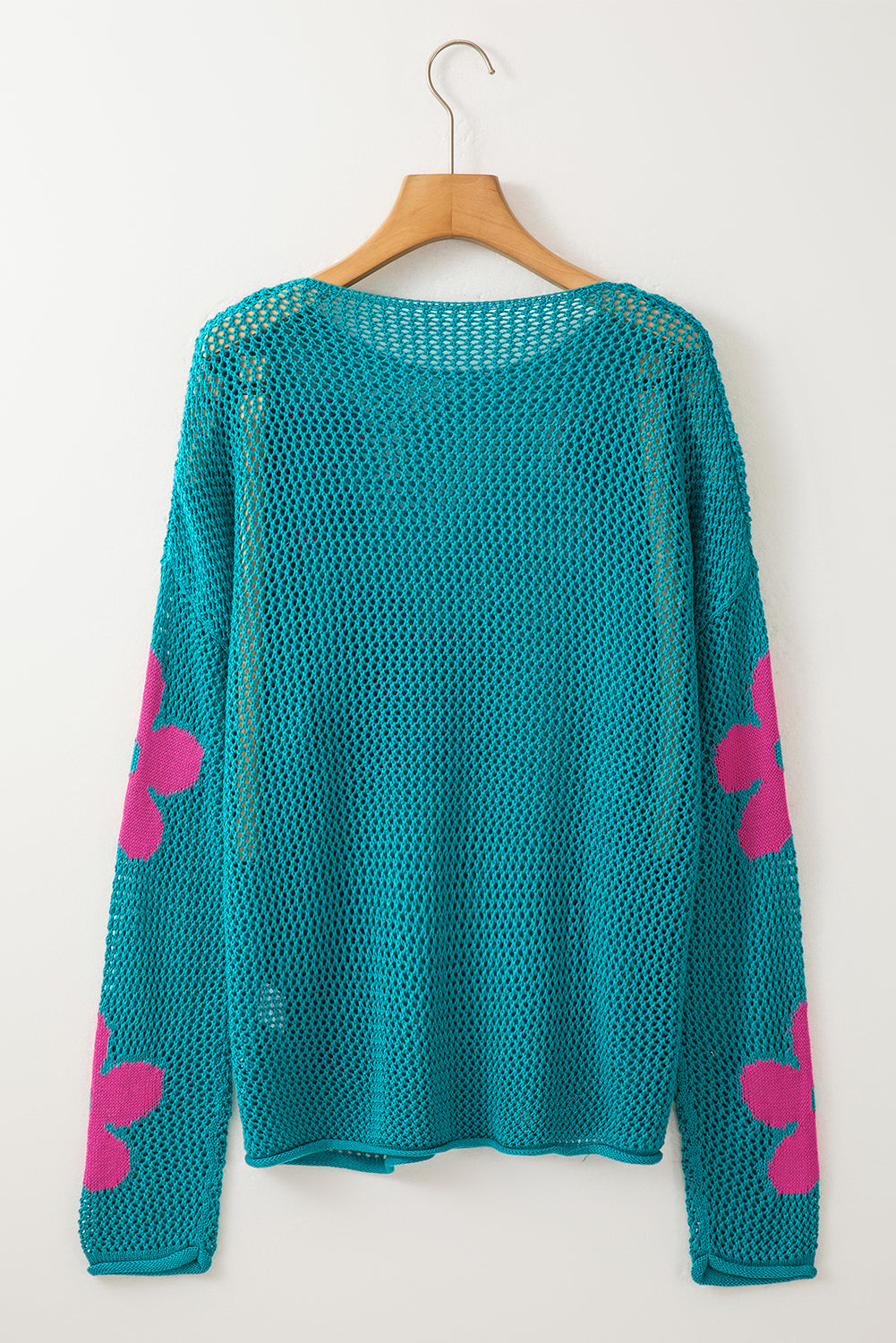 Meergrüner pullover mit großer blume und hohlen schultern aus strick