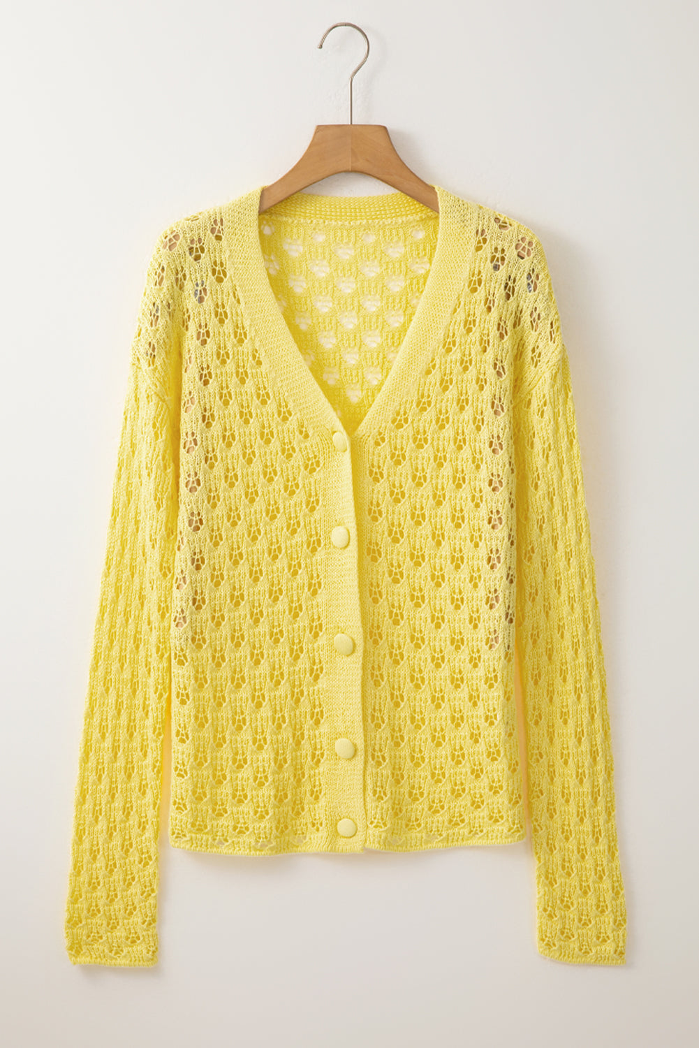 Gelber pointelle-strickpullover mit v-ausschnitt strickjacke
