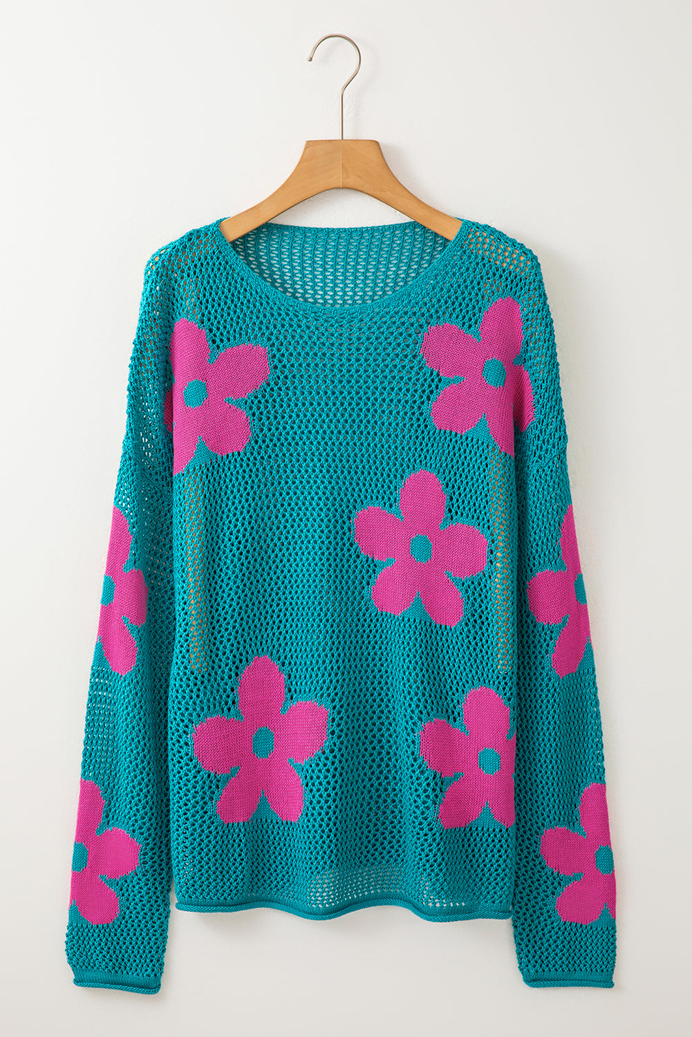 Meergrüner pullover mit großer blume und hohlen schultern aus strick