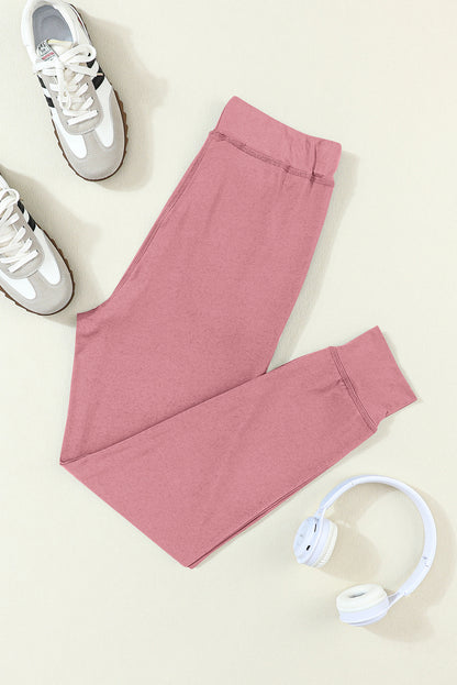 Fushia joggen broek met een koord- en zakdragers