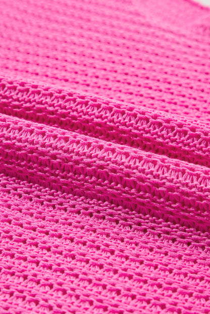 Roze massieve, losse brei -trui met korte Dolman -mouwen