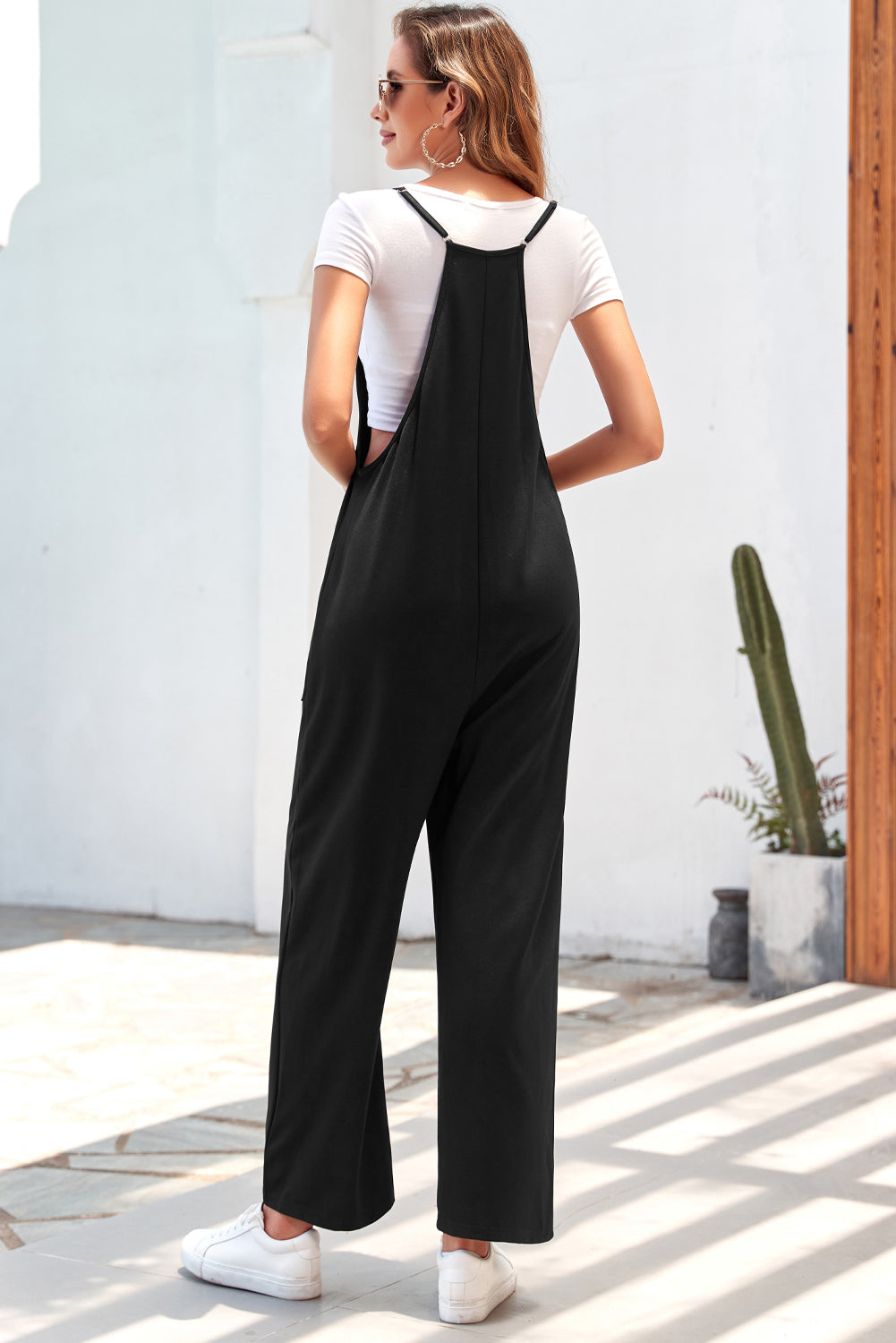 Zwart zak met verstelbare spaghetti -riemriemriempoot jumpsuit