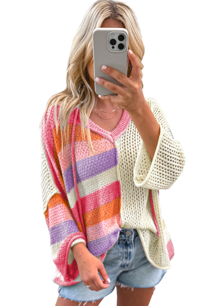 Roze oversized kleurbloktrui met een v-hals en kap