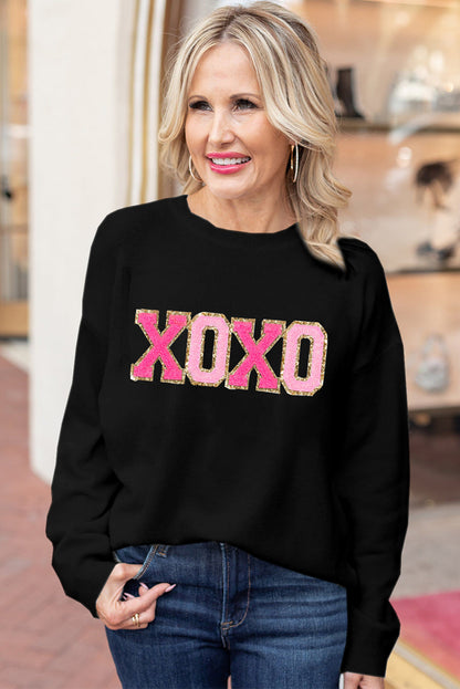 Schwarzer xoxo glitter print rundhalsausschnitt casual pullover