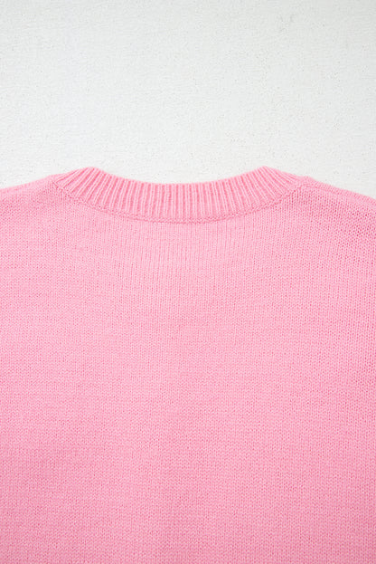 Rosa niedliche strickjacke mit blumenmuster und knopfleiste