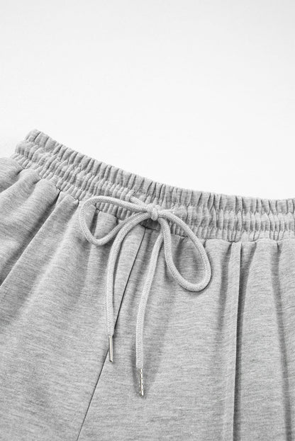 Hellgraue cargo-sweatpants mit kordelzug an der taille