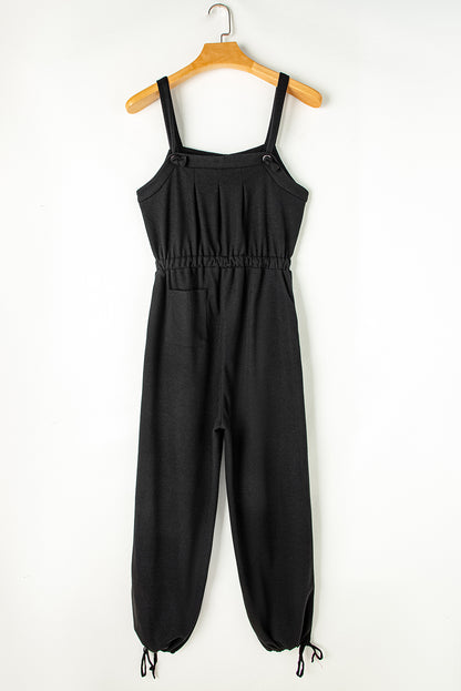 Zwarte jumpsuit met geknoopte riemen en gestructureerde snoerstam