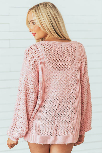 Pinker pullover mit geripptem v-ausschnitt aus lockerem pointelle-strick